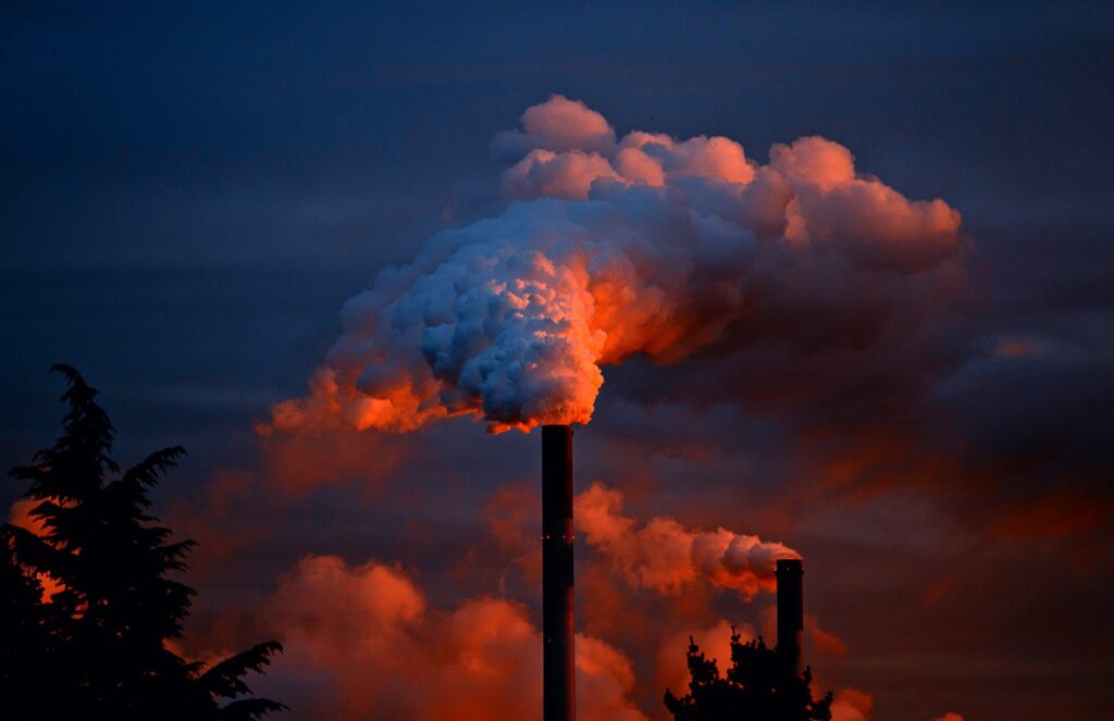 smoke coming out of factory pipes