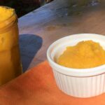 Homemade pumpkin puree in a jar and dish.