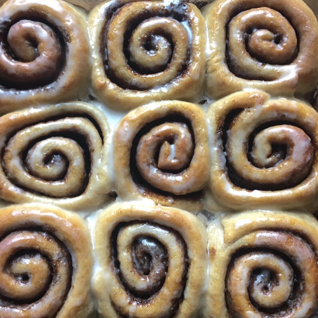 Vegan gingerbread cinnamon rolls with icing.