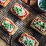 Plant-based tofu parmesan on a cooling rack.