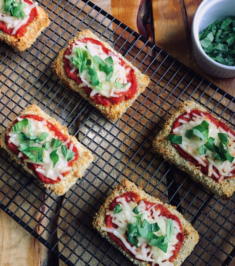 Plant-based tofu parmesan on a cooling rack.