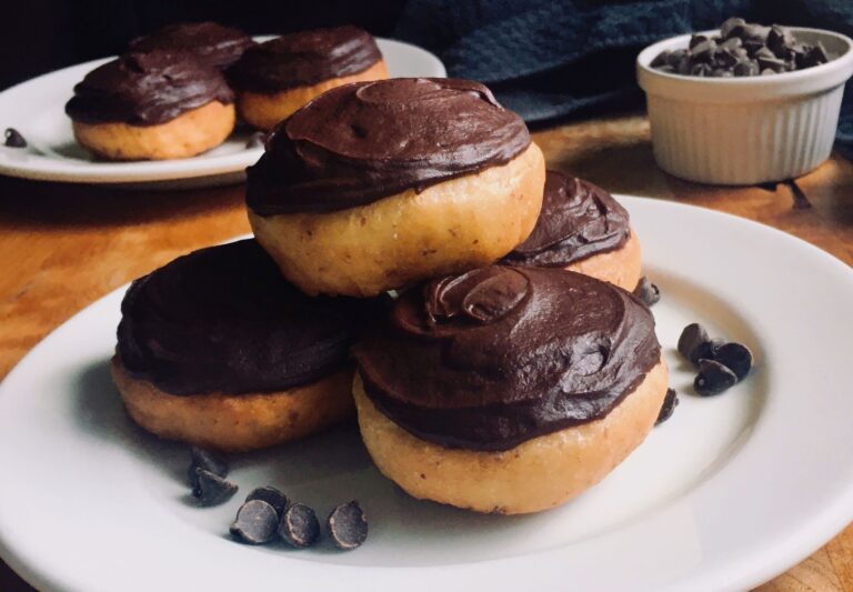 vegan yeast doughnuts with chocolate frosting and strawberry filling.