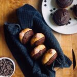 Chocolate Strawberry doughnuts. Vegan yeast donuts with chocolate icing and strawberry cream filling.