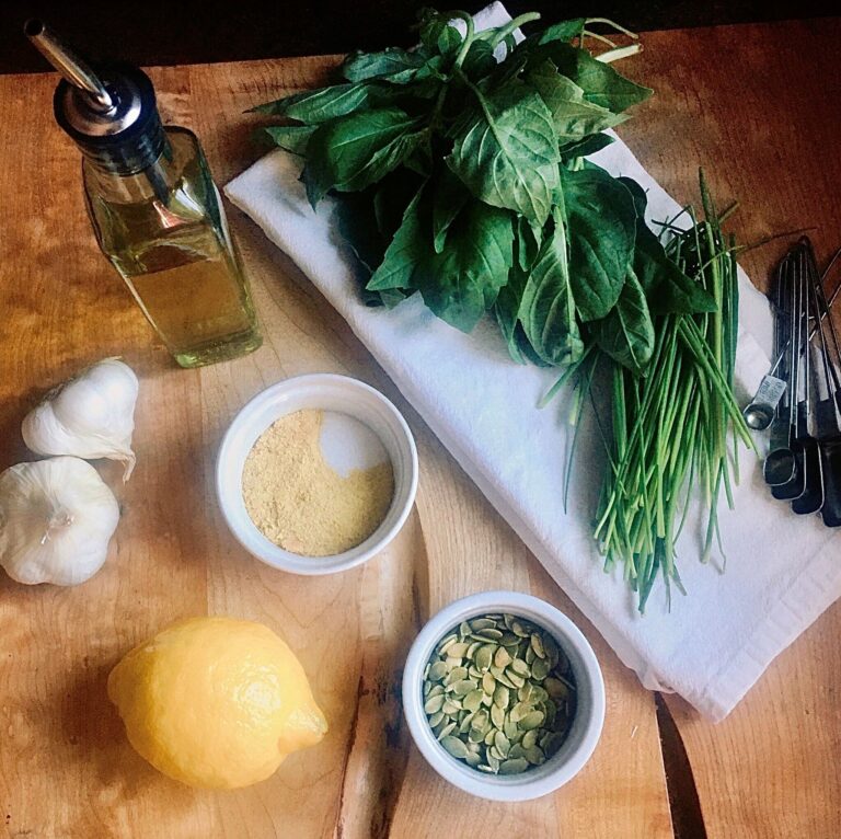 Ingredients for vegan herb pesto with pumpkin seeds.