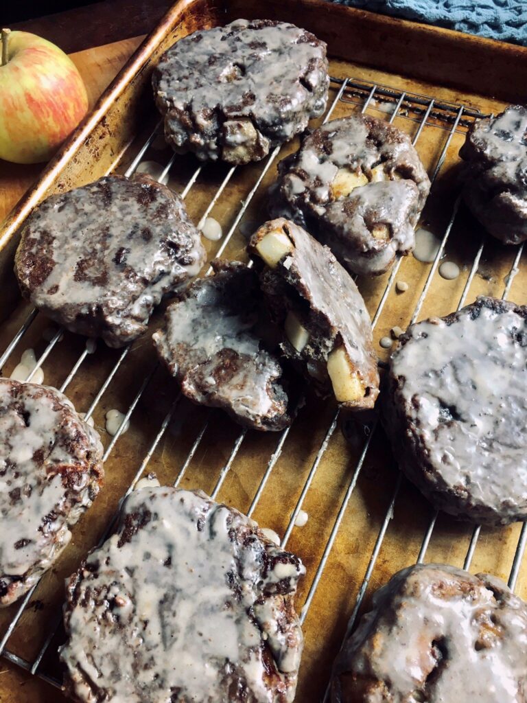 apple fritters cooling on a wire rack.