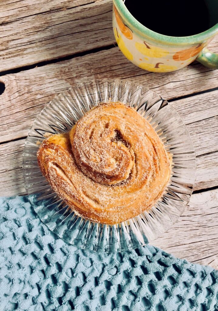 Vegan pumpkin morning buns, made with a croissant dough and filled with pumpkin then rolled in spiced sugar.