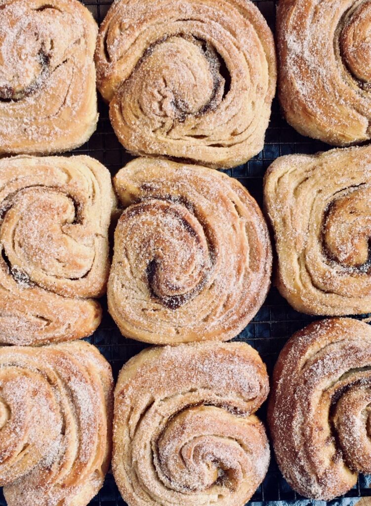 Vegan pumpkin morning buns on a tray.